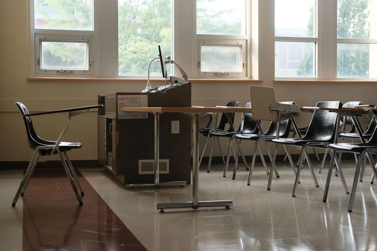 University classroom with rows of desks and chairs