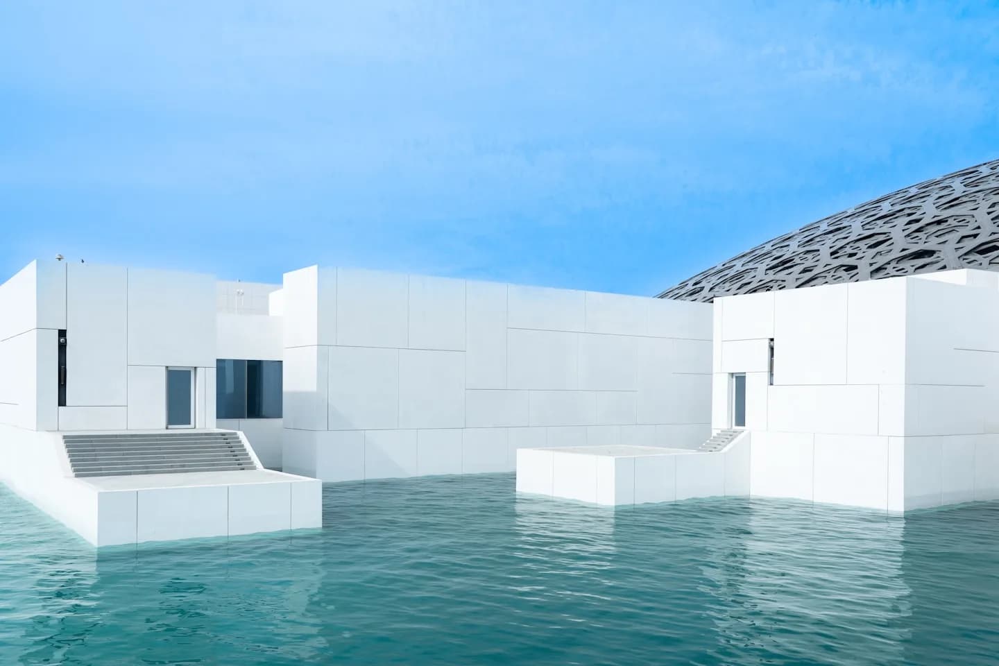 The Louvre Abu Dhabi beside the water