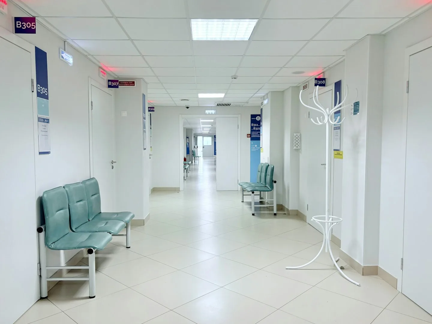 A bright healthcare corridor with waiting benches