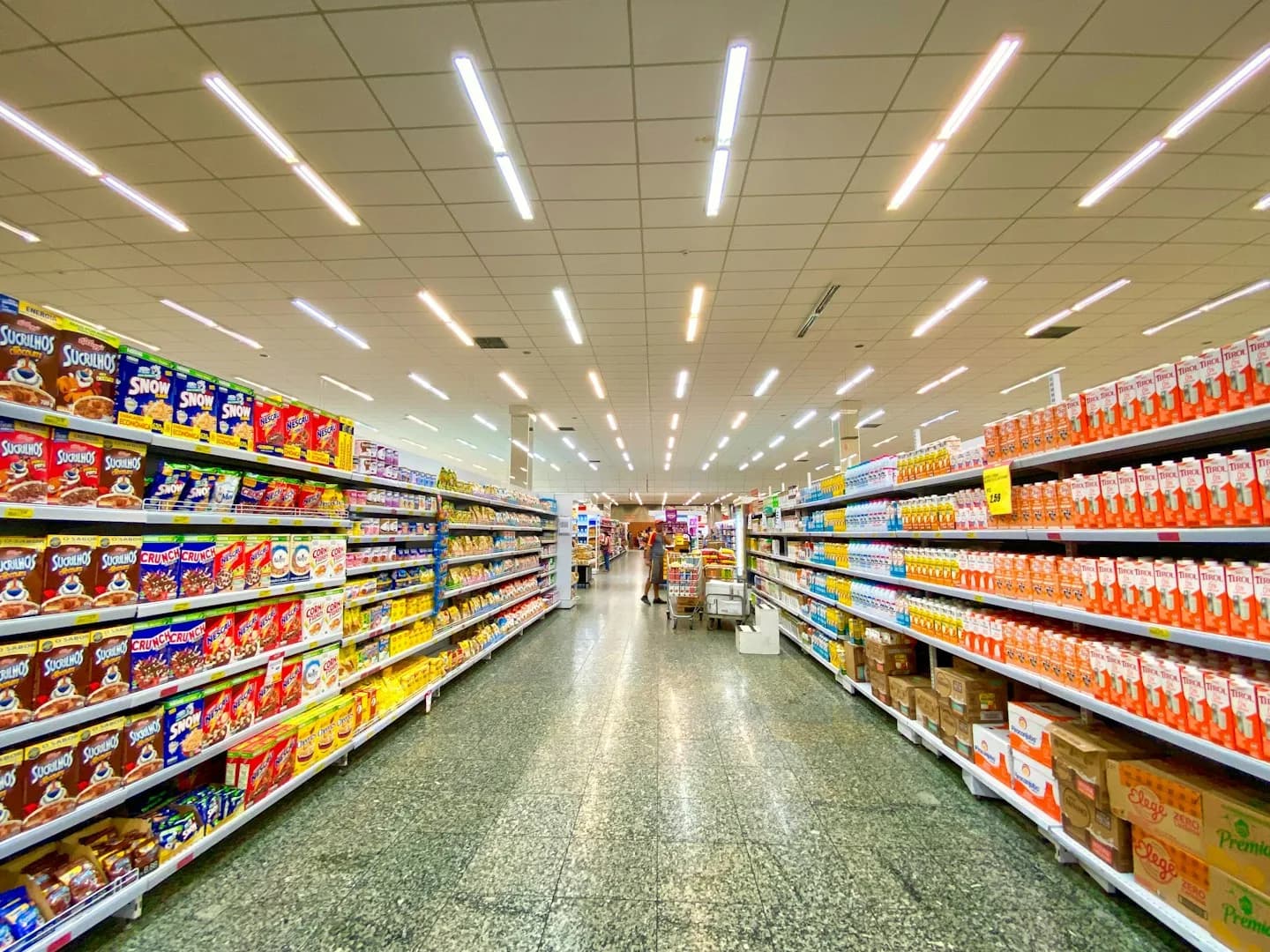 Supermarket aisles with stocked product shelves
